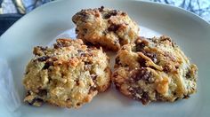 four cookies sitting on top of a white plate