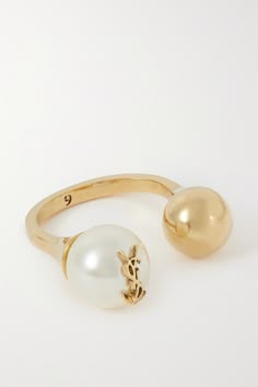 SAINT LAURENT's ring has an open, cuff-style shape. Molded from gold-tone metal with an aged finish, it has a small ball and a creamy faux pearl topped with the brand's signature 'YSL' lettering. Gold And Money, Modern Genshin, Outfits For Spain, Ysl Jewelry, Brooklyn Townhouse, Charles And Keith, What Do I Wear, Nyc Outfits, Cute Jewellery