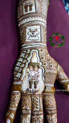 the hand is decorated with intricate designs