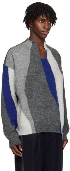 Knit stretch acrylic- and wool-blend sweater. Intarsia stripes throughout. · Rib knit stand collar, asymmetric hem, and cuffs · Keyhole at collar · Logo flag at cuff · Logo plaque at back yoke Supplier color: Blue Intarsia Sweater, Ader Error, Knitwear Men, Wool Blend Sweater, Blue Sweaters, Asymmetric Hem, Stand Collar, Blue Man, Rib Knit