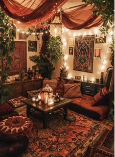 a living room filled with lots of furniture and lights on the ceiling above it's coffee table