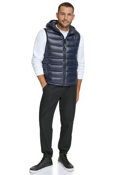 Easy to layer, this puffer-style vest features an attached hood that furthers the comfort. Attached hood Sleeveless 100% polyester Machine wash Imported Model stats: 6'1" height, 32" waist. Model is wearing size M. Hooded Puffer Vest, Puffer Style, Style Vest, Nordstrom Store, Anniversary Sale, Puffer Vest, Nordstrom Rack, Calvin Klein, Puffer