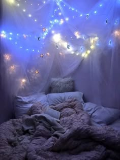 an image of a bed with lights in the background