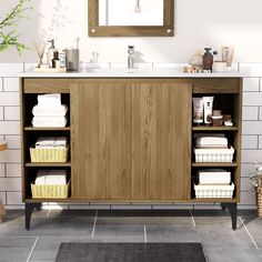 a bathroom with a sink and wooden cabinet