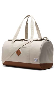 Double carrying handles define a classic duffle designed with contrast trim and a sleek silhouette crafted of recycled materials. Recycled polyester Imported This product meets Nordstrom Sustainably Sourced Materials criteria: contains at least 30% sustainably sourced materials Duffle Bag Photography, College Shopping, Luxury Bags Collection, Gap Year, Bags Aesthetic, Herschel Supply Co, Shopping Ideas, Silhouette Crafts, Herschel Supply