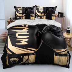 a bed with two boxing gloves on it and pillows in the corner next to them