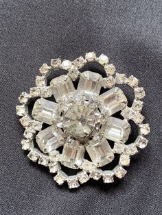 "Rhinestone Pin, rhinestone Jewelry, Dress Brooch, Ladies Pin, Vintage fashion, Vintage Party Pin,Cocktail Pin,Costume Jewelry,Crystal Diamente Brooch 2\" x 2\". No stones missing. No maker Great vintage condition. Stunning classic design. We refund shipping over $2. Ask about international shipping. Check out: Instagram: https://www.instagram.com/rusticbuckets/ Facebook: https://www.facebook.com/rusticbuckets Pinterest: @rusticbuckets Our sister store Rustic Buckets South for more items: https: Glamorous Rhinestones Brooches For Party, Party Crystal Brooches Costume Jewelry, Crystal Rhinestone Brooches For Costume Jewelry, Crystal Rhinestone Brooches Costume Jewelry, Formal Crystal Brooches With Rhinestones, Formal Crystal Rhinestone Brooches, Crystal Round Brooch For Party, Round Crystal Brooch For Party, Crystal Brooches With Sparkling Stones For Party