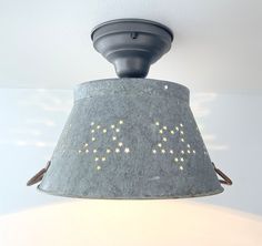 a light fixture with stars painted on it