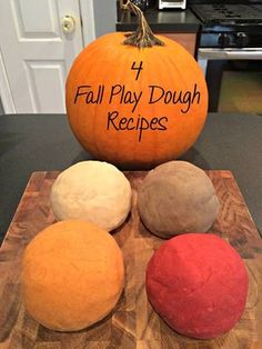 four different types of dough on a cutting board next to a pumpkin with the words, 4 fall play dough recipes