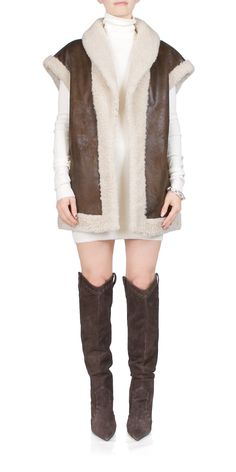 Luxury Faux Fur Vest, Faux Fur Coat Vest, Luxury Sheepskin Women's Vest, Luxury Classic Vest, Luxury Brown Vest With Pockets, Chic Brown Winter Vest, Elegant Brown Winter Vest, Sleeveless Sheepskin Vest For Fall, Fall Sheepskin Sleeveless Vest