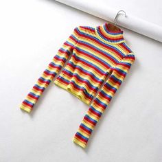 Details:      10% OFF   New Year Deals Promo code:   sunifty.    Free Shipping $70, Free Exchange & Easy Returns. Buy 1 Get 1  extra 15% OFF ALL Tops, Dresses & Separates, Code:       SUNIDRESS.    The colorful cropped sweater     features colorful neon rainbow strips, color block, elastic fitting, turtleneck and crop top. Can be paired with jeans, pants, leggings, skirts, and under any coats & jackets. Be delighted with a colorful long sleeve pullover sweater everyday!  Material: 80% Cotton & 20% Polyester Color: rainbow color Size Details: Shoulder 33 cm, Sleeve 60 cm, Bust 72-92 cm, Length 39 cm Design: Retro, Elastic Fitting, Striped, Fitted, Turtle Neck, Knitted, Vintage and Fashion Style. Weight: approx 0.28 kg Machine Wash Cold. Cropped Turtleneck Sweater, Cropped Turtleneck, Slim Sweater, Fall Winter Dresses, Long Sleeve Pullover Sweater, Colorful Rainbow, Mid Length Dresses, T Shirt Vest, Winter Sweaters