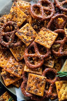 a plate full of cheesy pretzels and crackers