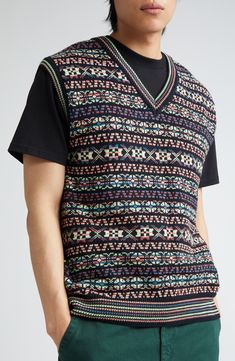 Fair Isle–inspired graphics—with a side foray into '80s arcade games—enliven this sporty sweater-vest knit from soft organic cotton. 26" length (size Medium) V-neck 100% cotton Dry clean or machine wash, dry flat Made in Portugal Designer Clothing Casual Vest With Graphic Print For Fall, Casual Graphic Print Vest For Fall, Multicolor Cotton Sweater Vest For Winter, Casual Fair Isle Pattern Sweater Vest For Winter, Casual Fair Isle Pattern Vest For Winter, Casual Multicolor Tops With Fair Isle Pattern, Casual Fair Isle Sweater Vest For Winter, Casual Jacquard Knit Sweater Vest For Winter, Casual Fair Isle Vest For Winter