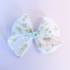 Beautiful star hairbow for girls. Perfect as pigtails or even for one pony tail  Hair bow is sewed. Please be gentle due to the delicacy of the bow. Due to the nature and style of the bow Each now is handcrafted slightly different making them each unique.  If you have any questions or concerns regarding your order, please email us at marleysbow@gmail.com Putting a smile on your face is our top priority! Tulle Hair Bow, Tulle Hair Bows, Pony Tail Hair, Gold Tulle, Bible Bookmark, Tail Hair, Tassel Bookmark, Getting Played