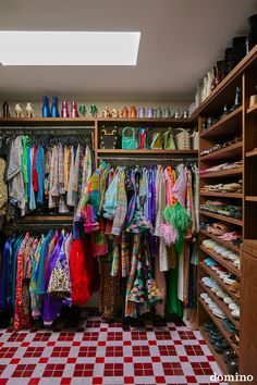 the closet is full of colorful clothes and shoes