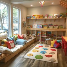 a child's playroom with lots of toys and books