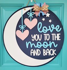 a door sign that says i love you to the moon and back