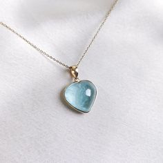 This stunning heart pendant is set in 14K Solid Yellow Gold with Natural Aquamarine with utmost precision. It is an unique gemstone pendant for nearly every occasion and is completely hassle-free jewelry. ITEM DETAILS * Gem: Aquamarine * Gem Size: 14X15mm * Gem Shape: Heart * Gem Weight: 9.37 carats * Gold Purity: 14KT  * Gold Weight: 0.52 gram * Total Weight of the Pendant: 2.39 gram The Gold purity is guaranteed and it comes with authentic 14KT gold hallmark. Since my items are handmade, they are absolutely nickel and lead free. CUSTOMIZATION * Gemstone customization is available and it can be substituted with a gem of your choice. Kindly message me for the same. PACKAGING * The Pendant comes with layers of safe and secure wrapping along with Free handmade jewelry box with every purchase Sapphire Heart Pendant With Heart Charm, Sapphire Heart Pendant Jewelry As Gift, 14k Gold Heart Necklace With Gemstone, Fine Jewelry Gemstone Heart Necklace For Anniversary, Fine Jewelry Heart Necklace With Gemstone For Anniversary, Pear-shaped Gemstone Jewelry For Valentine's Day, 14k Gold Gemstone Heart Necklace For Valentine's Day, Pear-shaped Jewelry For Valentine's Day Gift, Valentine's Day Pear-shaped Gemstone Jewelry