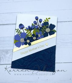 a card with blue flowers and green leaves on it that says happy mother's day