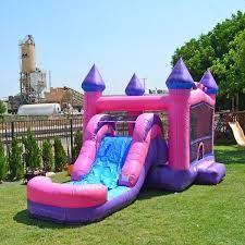 an inflatable bouncer and slide on the lawn