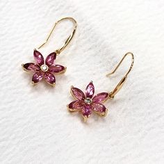 Pink Tourmaline set in 18K Gold Ear Wire This pair of earring is a fine jewelry made up of top quality pink tourmaline and diamond set in 18K gold. Materials : Gemstone : 12 pieces of A grade marquise cut red tourmaline Diamond : 0.03ct brilliant cut diamond SI quality Gross weight : 1.7g Packing : Nice Gift box Delivery : The earring is ready to be delivered BY E-express AIR PARCEL POST/ Registered Air Post (free shipment) and it will arrive in 2-3 WEEKS or you may choose to upgrade your shipme Pink Diamond Earrings For Formal Occasions, Fine Jewelry Pink Diamond Earrings For Formal Occasions, Pink Diamond Earrings For Formal Events, Fine Jewelry, Elegant Pink Sapphire Earrings For Wedding, Pink Diamond Drop Earrings Fine Jewelry, Pink Diamond Drop Earrings In Fine Jewelry Style, Elegant Rose Gold Earrings With Pink Sapphire, Elegant Rose Gold Pink Sapphire Earrings, Luxury Pink Sapphire Earrings As Gift