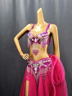 a mannequin wearing a pink belly dance costume