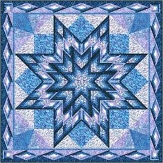 a blue and white quilt with an intricate star design