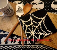 a crocheted dishcloth and wooden spoons on a table