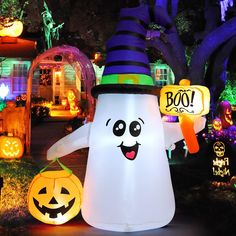 a large inflatable ghost with two jack - o'- lantern faces on it