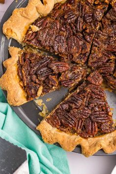 a pecan pie with one slice missing from it