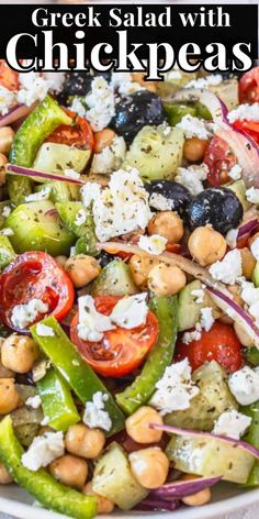 greek salad with chickpeas in a white bowl