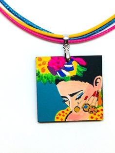 Frida Kahlo-inspired Necklace - Pendant - 100% Hand Painted Frida jewelry. Made from scratch. Original artwork. No prints. We put our heart and soul into making something really special for our shop at Fridamaniacs. We wanted to create something very unique. Something you won't find everywhere else on Etsy or other places. Every single piece is unique in the whole universe!!! This gorgeous hand painted Frida Kahlo pendant is a beautiful mini masterpiece. Original Artwork. We created it using hig Adjustable Multicolor Hand Painted Necklace, Artistic Hand Painted Turquoise Jewelry, Artisan Hand Painted Multicolor Jewelry, Artistic Hand-painted Turquoise Jewelry, Artisan Hand Painted Blue Necklaces, Artisan Multicolor Hand Painted Jewelry, Multicolor Artistic Necklace For Gifts, Artisan Blue Hand Painted Necklaces, Colorful Artsy Necklace For Gifts