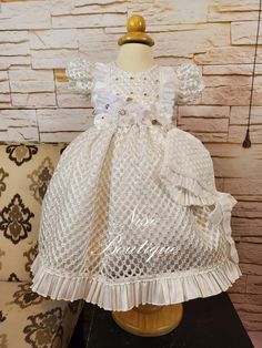 "★White Christening Gown, Baptism Dress★ ★Occasion: Baptism, Child Blessing or any Special Occasion ★Comes With: Dress and Bonnet ★Measurements 9-12 months, (Long 21\") (Waist 19\") 12-18 months, (Long 23\") (Waist 20\") 18-24 months, (Long 25\") (Waist 21\") (Shoulder to Shoulder 9\") -Waist measurement is around ★Features: The back is open, for comfort when you load the baby (The waist is adjustable, has two ribbons to make a bow, as in the photo) Please check the measurements, and any questio White Short Sleeve Princess Baptism Dress, Fitted Cream Princess Baptism Dress, White Short Sleeve First Communion Dress With Ruffles, White First Communion Dress With Ruffles And Short Sleeves, Cream Baptism Dress With Ruffles For Pageant, Princess Style Fitted Baptism Dress, Cream Ruffled First Communion Dress For Baptism, Fitted Princess Style Baptism Dress, Pageant Baptism Dress In Cream With Ruffles