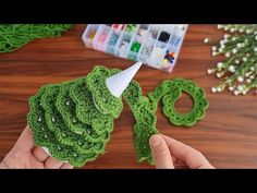 someone is making crochet christmas tree decorations