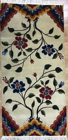 a rug with flowers and leaves on it