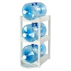 three plastic water bottles stacked on top of each other in a white rack against a white background