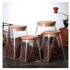 three glass jars filled with coffee beans