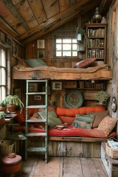 a loft bed in the middle of a room with bookshelves and other items