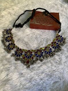 Handmade Banjara Mirror Necklace, Beautiful Multicolor Mirror Work, And Thread work, Antique Silver Look-Alike Necklace for Women, Add charm and charisma to your beautiful personality with these beautifully designed and handcrafted Brass necklace. The antique finish gives this Necklace a very eye-catching look. The Necklace is also designed beautifully and compliments the Necklace very well. Wear it with any of your formal or casual outfits and grab compliments all the way! Multicolor Necklace With Intricate Design For Ceremonial Occasions, Ceremonial Multicolor Necklace With Intricate Design, Multicolor Bohemian Kundan Necklace With Intricate Design, Handmade Multicolor Temple Jewelry Choker, Multicolor Ceremonial Necklaces For Festivals, Traditional Multicolor Necklace With Intricate Design, Multicolor Cutdana Temple Jewelry Necklace, Multicolor Cutdana Choker For Festivals, Vintage Multicolor Necklaces For Festive Occasions