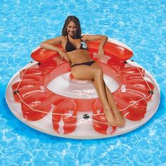 a woman laying on an inflatable floating raft