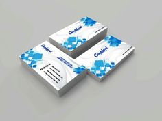 three business cards with blue squares on them