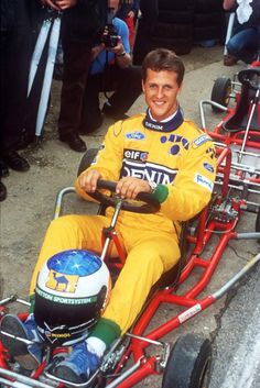 a man sitting in a go kart at an event