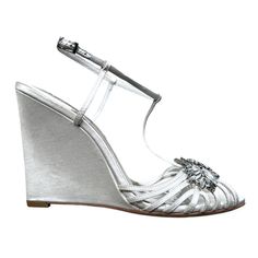 a woman's silver wedged sandal with an open toe and flower decoration