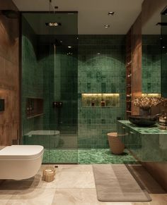 a green tiled bathroom with a tub and sink