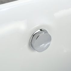 a white sink with a chrome faucet on it's left hand side