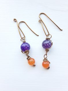 Handmade jewelry, copper wire wrapped earrings, bracelets, and necklaces, semi-precious gemstones and glass beads, unique design. ~Unique Design~ Each piece is designed and handcrafted by me. All of these unique styles are made to order especially for you. ~Who is this jewelry great for?~ An elegant, boho, classic style. You can wear it for a casual day or a dressed-up night on the town. This jewelry is a perfect gift for your mother, sister, girlfriend, wife, daughter or anyone who loves beautiful handmade jewelry. ~Materials~ Your handcrafted jewelry is made with various shades of copper or stainless steel wire. These wires are hypoallergenic for most people. They may tarnish over time if exposed to water. The beads used are semi-precious stones, glass, or ceramic.  ~Gifts~ Each order co Wire Wrapped Czech Glass Drop Earrings, Handmade Spiritual Wire Jewelry, Purple Wire Wrapped Czech Glass Jewelry, Wire Wrapped Healing Drop Earrings, Healing Wire Wrapped Drop Earrings, Bohemian Orange Wire Wrapped Jewelry, Orange Hand Wrapped Bohemian Jewelry, Orange Bohemian Hand Wrapped Jewelry, Bohemian Hand Wrapped Orange Jewelry