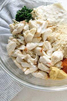 a glass bowl filled with different types of food