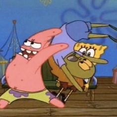 spongebob and patrick dancing together in front of an amusement park