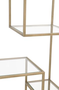 two metal and glass shelves with one shelf on each side, the other half empty