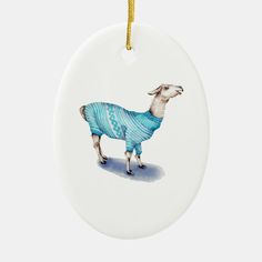 a ceramic ornament with an image of a llama wearing a blue sweater